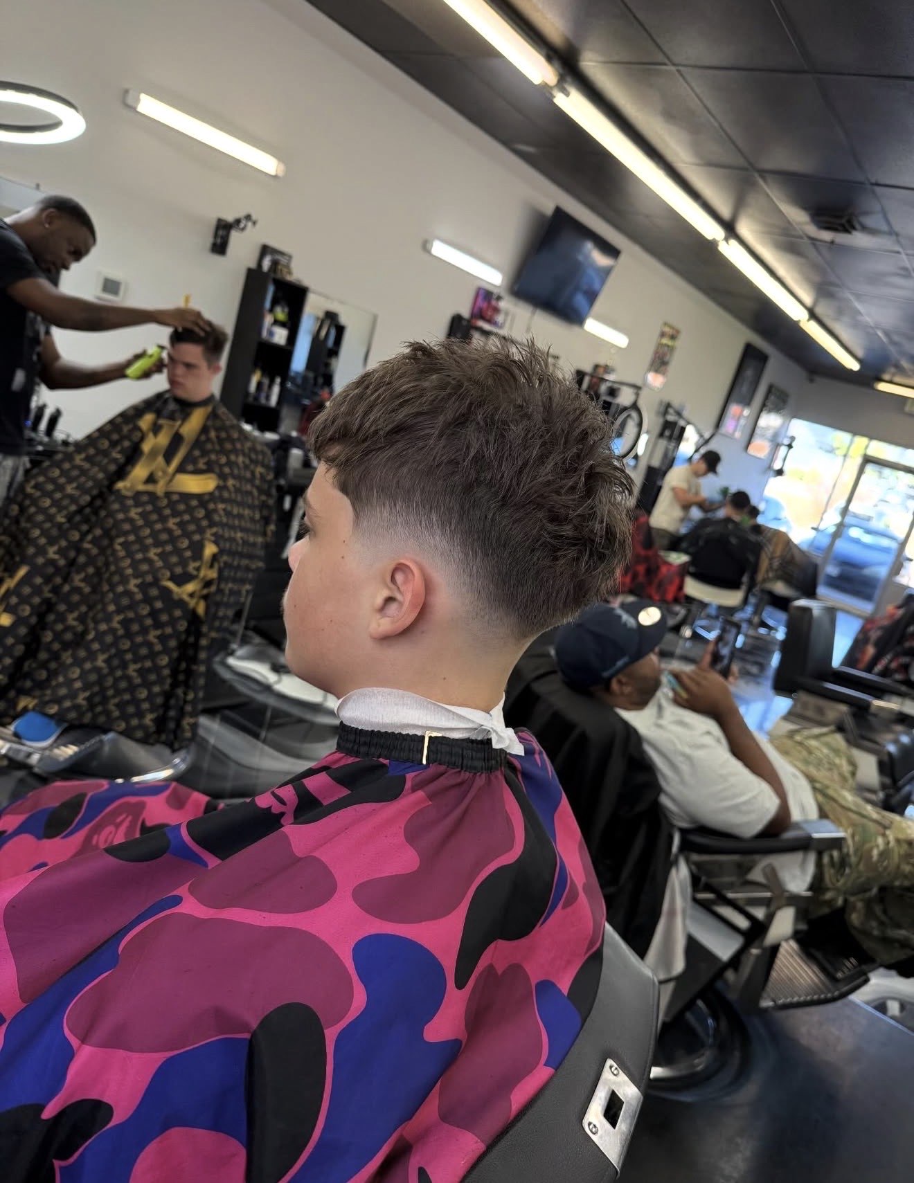 Textured taper fade finished at Don Barbas
